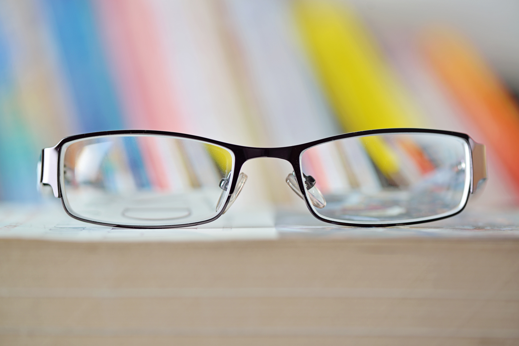 Eyeglass on book